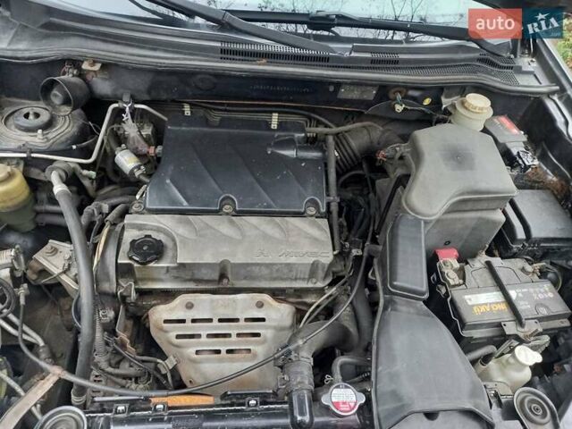 Серый Мицубиси Аутлендер, объемом двигателя 2.38 л и пробегом 143 тыс. км за 7300 $, фото 20 на Automoto.ua