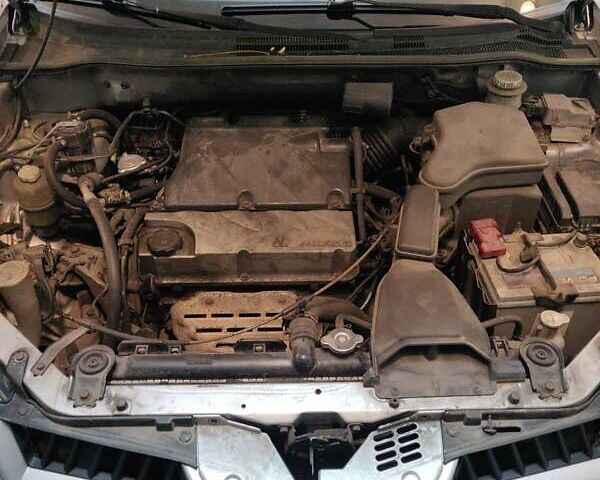 Серый Мицубиси Аутлендер, объемом двигателя 2.38 л и пробегом 323 тыс. км за 6800 $, фото 36 на Automoto.ua