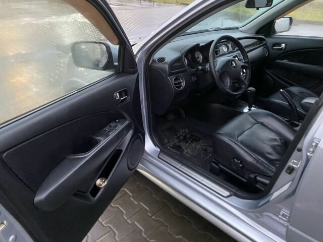 Сірий Міцубісі Аутлендер, об'ємом двигуна 2.4 л та пробігом 299 тис. км за 6300 $, фото 7 на Automoto.ua