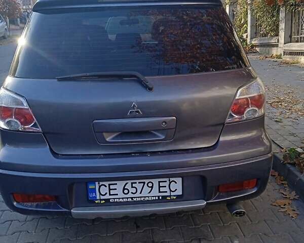 Серый Мицубиси Аутлендер, объемом двигателя 2 л и пробегом 172 тыс. км за 5900 $, фото 3 на Automoto.ua