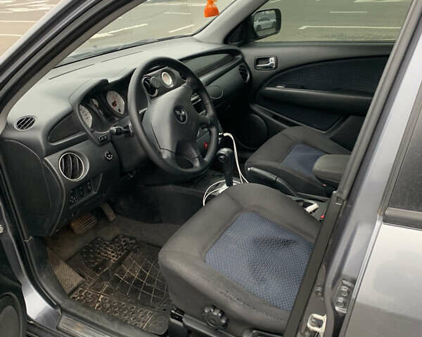 Серый Мицубиси Аутлендер, объемом двигателя 2.38 л и пробегом 227 тыс. км за 6600 $, фото 8 на Automoto.ua