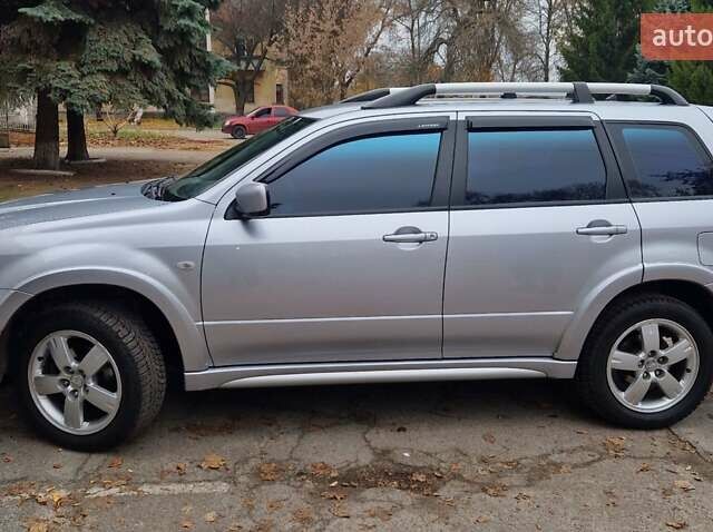 Серый Мицубиси Аутлендер, объемом двигателя 2.38 л и пробегом 113 тыс. км за 8900 $, фото 6 на Automoto.ua