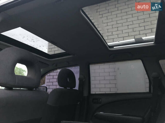 Серый Мицубиси Аутлендер, объемом двигателя 2 л и пробегом 170 тыс. км за 6950 $, фото 7 на Automoto.ua