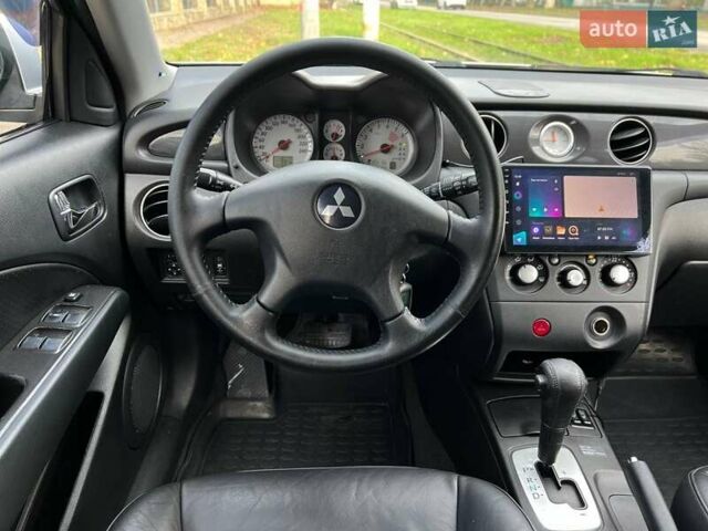 Серый Мицубиси Аутлендер, объемом двигателя 2.38 л и пробегом 170 тыс. км за 6900 $, фото 14 на Automoto.ua