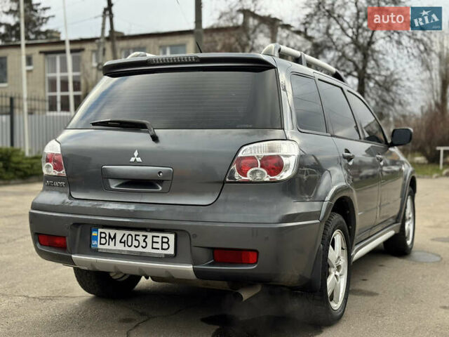 Серый Мицубиси Аутлендер, объемом двигателя 2.38 л и пробегом 254 тыс. км за 7300 $, фото 13 на Automoto.ua