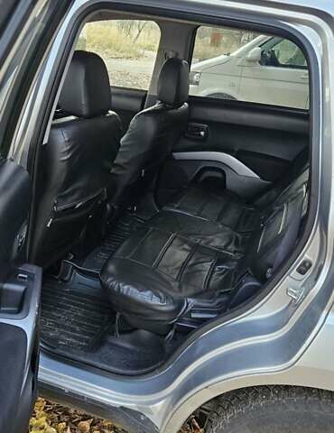 Серый Мицубиси Аутлендер, объемом двигателя 2.2 л и пробегом 280 тыс. км за 5300 $, фото 4 на Automoto.ua