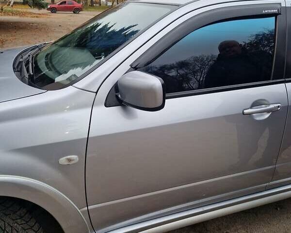 Серый Мицубиси Аутлендер, объемом двигателя 2.38 л и пробегом 113 тыс. км за 8900 $, фото 7 на Automoto.ua