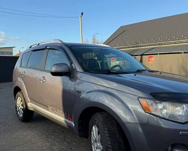 Серый Мицубиси Аутлендер, объемом двигателя 2.18 л и пробегом 287 тыс. км за 10200 $, фото 2 на Automoto.ua