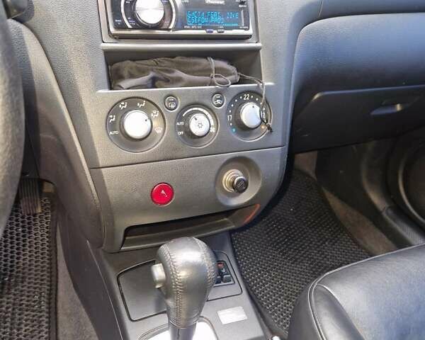 Серый Мицубиси Аутлендер, объемом двигателя 2.38 л и пробегом 113 тыс. км за 8900 $, фото 4 на Automoto.ua