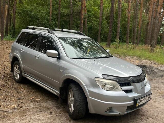 Серый Мицубиси Аутлендер, объемом двигателя 2.4 л и пробегом 225 тыс. км за 6500 $, фото 1 на Automoto.ua