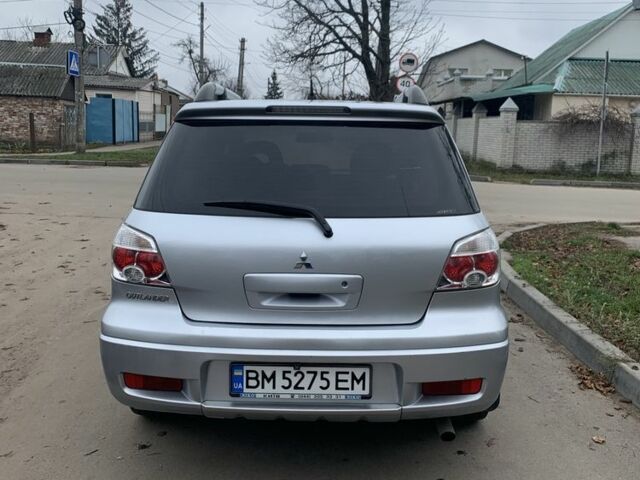 Серый Мицубиси Аутлендер, объемом двигателя 2 л и пробегом 247 тыс. км за 5999 $, фото 3 на Automoto.ua