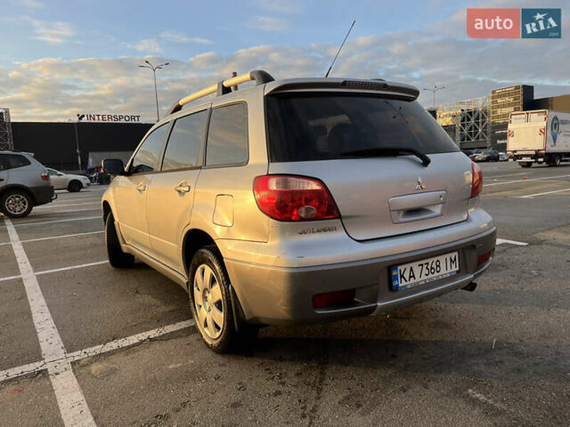 Серый Мицубиси Аутлендер, объемом двигателя 2 л и пробегом 138 тыс. км за 7000 $, фото 4 на Automoto.ua