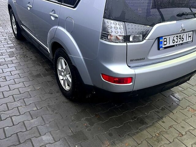 Серый Мицубиси Аутлендер, объемом двигателя 2.4 л и пробегом 241 тыс. км за 8200 $, фото 6 на Automoto.ua