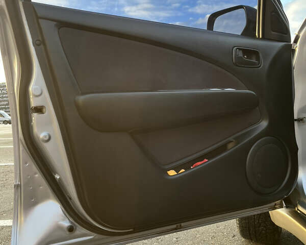 Серый Мицубиси Аутлендер, объемом двигателя 2 л и пробегом 138 тыс. км за 7000 $, фото 15 на Automoto.ua