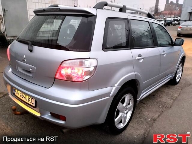 Серый Мицубиси Аутлендер, объемом двигателя 2 л и пробегом 198 тыс. км за 7400 $, фото 3 на Automoto.ua