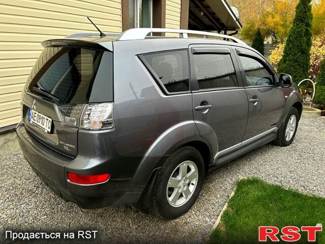 Серый Мицубиси Аутлендер, объемом двигателя 2.4 л и пробегом 153 тыс. км за 11500 $, фото 3 на Automoto.ua