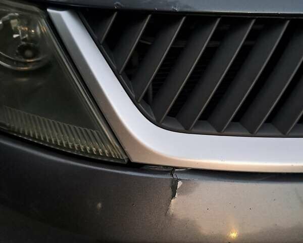 Серый Мицубиси Аутлендер, объемом двигателя 2 л и пробегом 275 тыс. км за 8000 $, фото 28 на Automoto.ua