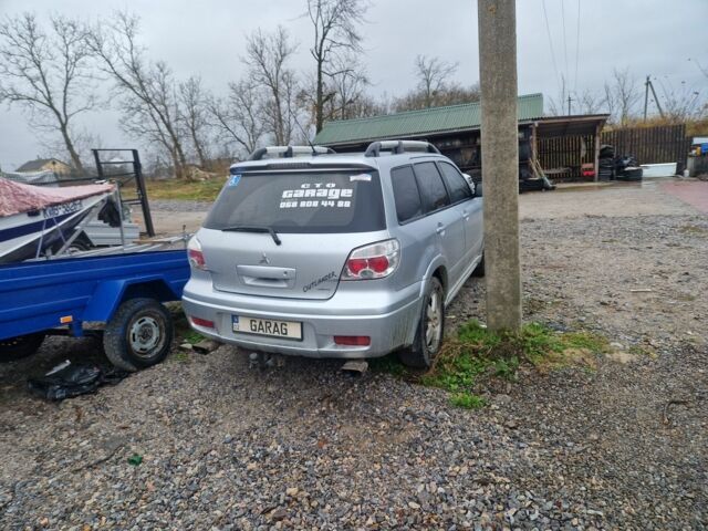 Серый Мицубиси Аутлендер, объемом двигателя 2.4 л и пробегом 350 тыс. км за 8000 $, фото 2 на Automoto.ua