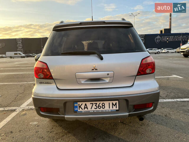 Серый Мицубиси Аутлендер, объемом двигателя 2 л и пробегом 138 тыс. км за 7000 $, фото 5 на Automoto.ua