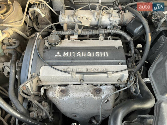 Серый Мицубиси Аутлендер, объемом двигателя 2 л и пробегом 138 тыс. км за 7000 $, фото 28 на Automoto.ua