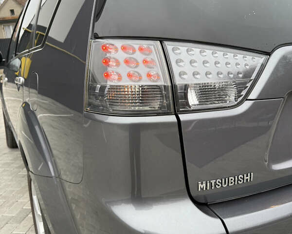 Серый Мицубиси Аутлендер, объемом двигателя 2.2 л и пробегом 162 тыс. км за 10000 $, фото 21 на Automoto.ua