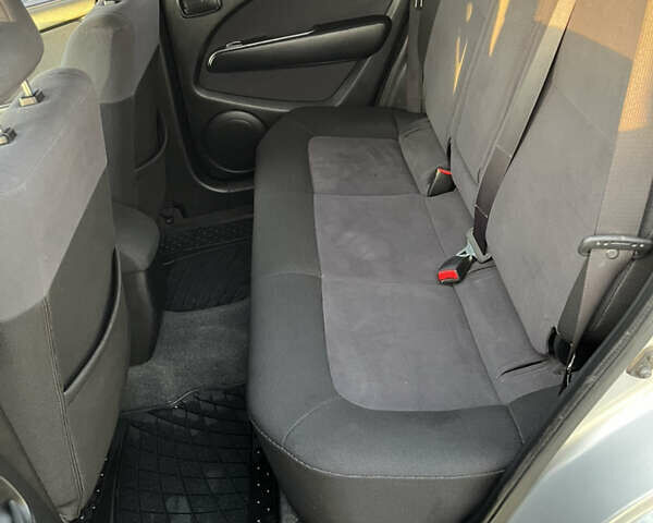 Серый Мицубиси Аутлендер, объемом двигателя 2 л и пробегом 138 тыс. км за 7000 $, фото 14 на Automoto.ua