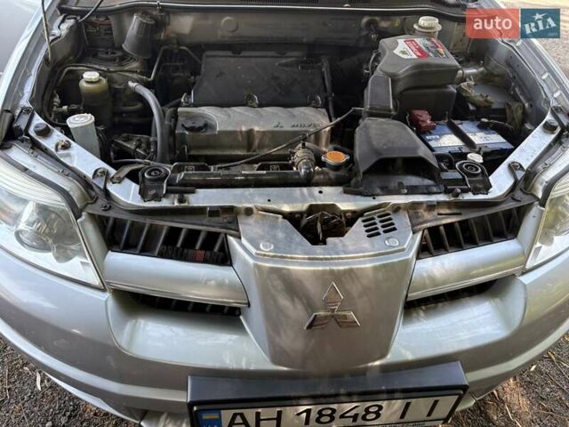 Серый Мицубиси Аутлендер, объемом двигателя 2.38 л и пробегом 127 тыс. км за 9999 $, фото 16 на Automoto.ua