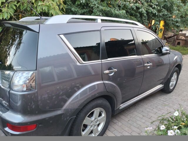Серый Мицубиси Аутлендер, объемом двигателя 2.4 л и пробегом 151 тыс. км за 11100 $, фото 1 на Automoto.ua