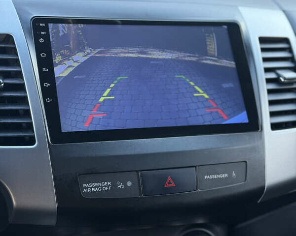 Серый Мицубиси Аутлендер, объемом двигателя 2.4 л и пробегом 218 тыс. км за 9950 $, фото 1 на Automoto.ua