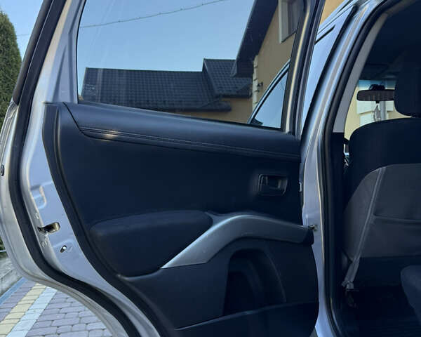 Серый Мицубиси Аутлендер, объемом двигателя 2.4 л и пробегом 218 тыс. км за 9950 $, фото 11 на Automoto.ua