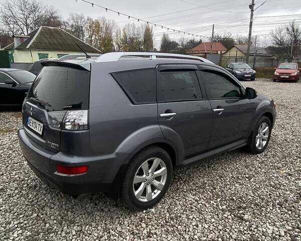 Серый Мицубиси Аутлендер, объемом двигателя 2.36 л и пробегом 143 тыс. км за 11500 $, фото 1 на Automoto.ua