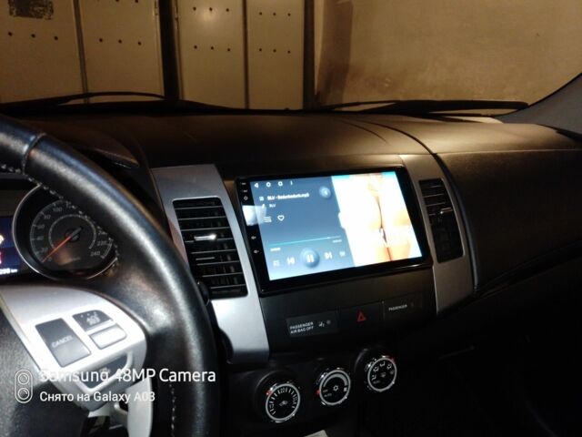 Серый Мицубиси Аутлендер, объемом двигателя 2.4 л и пробегом 151 тыс. км за 11100 $, фото 9 на Automoto.ua