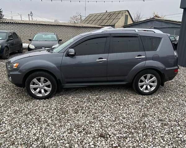 Серый Мицубиси Аутлендер, объемом двигателя 2.36 л и пробегом 143 тыс. км за 11500 $, фото 9 на Automoto.ua