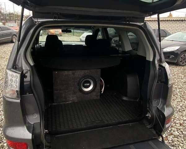 Серый Мицубиси Аутлендер, объемом двигателя 2.36 л и пробегом 143 тыс. км за 11500 $, фото 8 на Automoto.ua