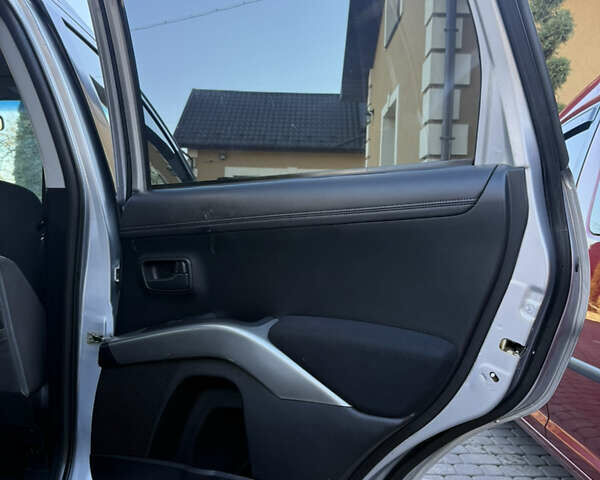 Серый Мицубиси Аутлендер, объемом двигателя 2.4 л и пробегом 218 тыс. км за 9950 $, фото 16 на Automoto.ua