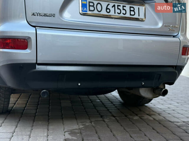 Серый Мицубиси Аутлендер, объемом двигателя 2.4 л и пробегом 218 тыс. км за 9950 $, фото 28 на Automoto.ua