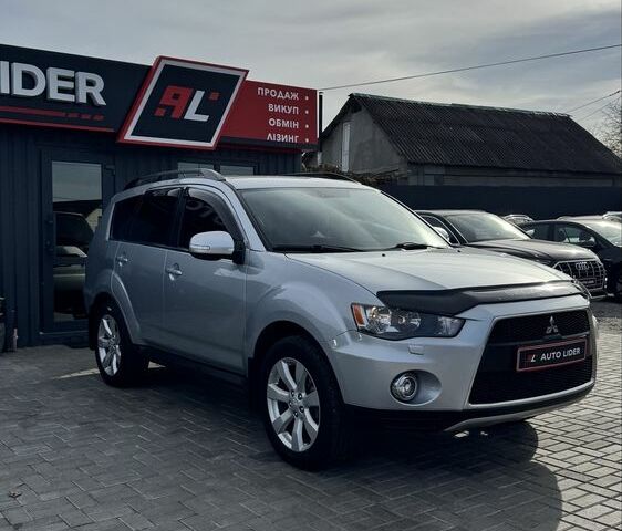 Серый Мицубиси Аутлендер, объемом двигателя 2.4 л и пробегом 239 тыс. км за 11700 $, фото 1 на Automoto.ua