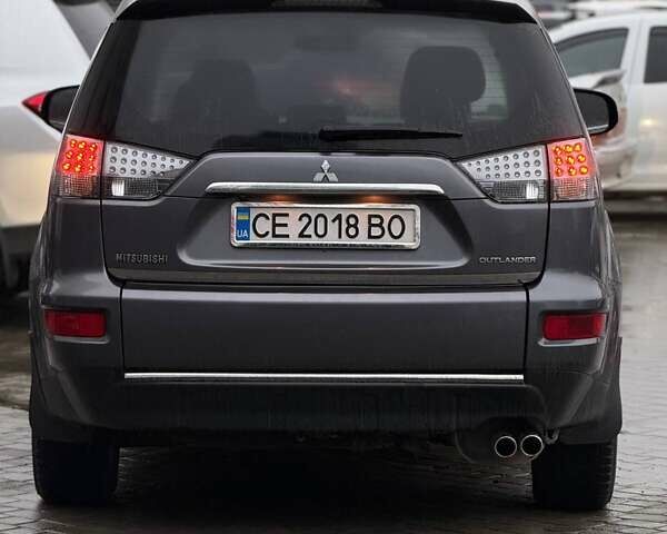 Серый Мицубиси Аутлендер, объемом двигателя 2.3 л и пробегом 160 тыс. км за 13900 $, фото 5 на Automoto.ua