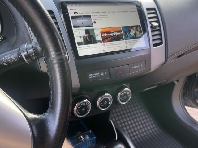 Серый Мицубиси Аутлендер, объемом двигателя 2 л и пробегом 136 тыс. км за 14999 $, фото 2 на Automoto.ua