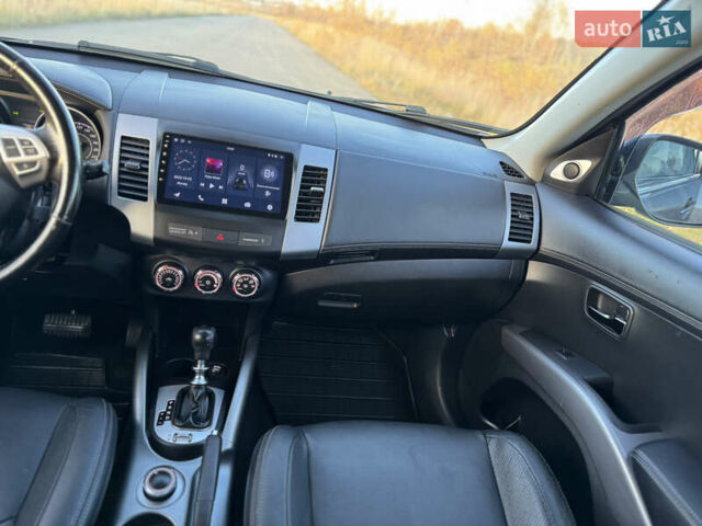 Серый Мицубиси Аутлендер, объемом двигателя 2.2 л и пробегом 171 тыс. км за 12700 $, фото 81 на Automoto.ua