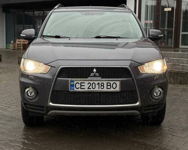 Серый Мицубиси Аутлендер, объемом двигателя 2.3 л и пробегом 160 тыс. км за 13900 $, фото 1 на Automoto.ua