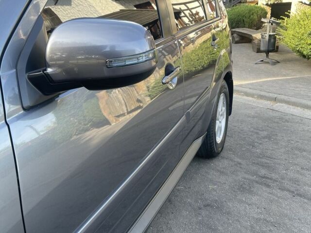 Серый Мицубиси Аутлендер, объемом двигателя 2 л и пробегом 136 тыс. км за 14999 $, фото 4 на Automoto.ua