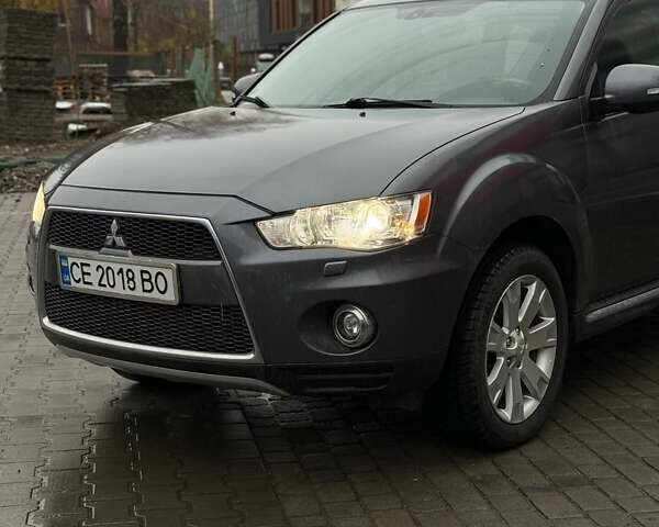 Серый Мицубиси Аутлендер, объемом двигателя 2.3 л и пробегом 160 тыс. км за 13900 $, фото 2 на Automoto.ua