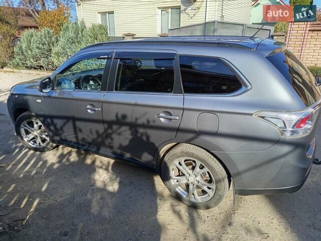 Серый Мицубиси Аутлендер, объемом двигателя 2.27 л и пробегом 240 тыс. км за 12150 $, фото 11 на Automoto.ua