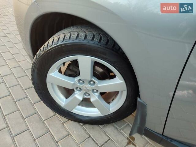 Серый Мицубиси Аутлендер, объемом двигателя 2.3 л и пробегом 250 тыс. км за 13499 $, фото 95 на Automoto.ua