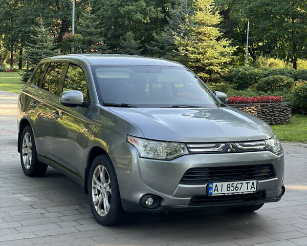 Серый Мицубиси Аутлендер, объемом двигателя 2.4 л и пробегом 150 тыс. км за 10750 $, фото 2 на Automoto.ua