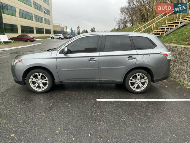 Сірий Міцубісі Аутлендер, об'ємом двигуна 2.4 л та пробігом 219 тис. км за 10800 $, фото 1 на Automoto.ua