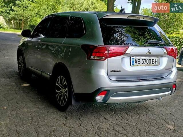 Серый Мицубиси Аутлендер, объемом двигателя 2.38 л и пробегом 153 тыс. км за 14800 $, фото 1 на Automoto.ua