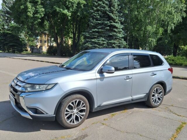 Серый Мицубиси Аутлендер, объемом двигателя 2.4 л и пробегом 160 тыс. км за 14200 $, фото 1 на Automoto.ua