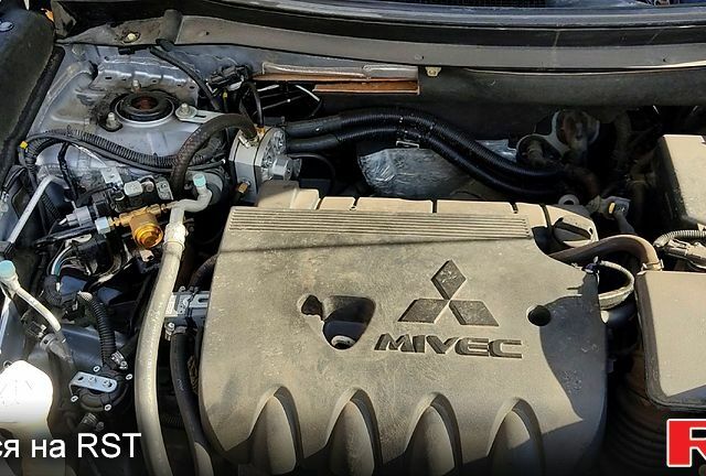 Серый Мицубиси Аутлендер, объемом двигателя 2.4 л и пробегом 160 тыс. км за 14777 $, фото 8 на Automoto.ua
